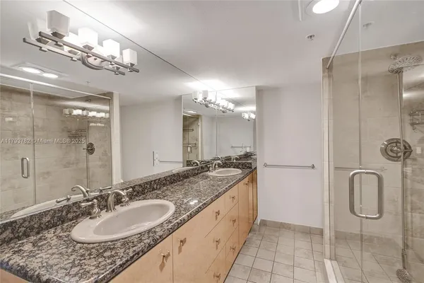 a view of a livingroom with wooden floor and entryway