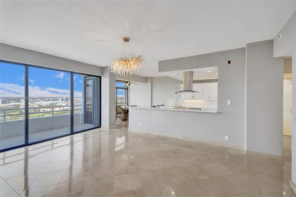 a kitchen with stainless steel appliances a refrigerator and a stove top oven