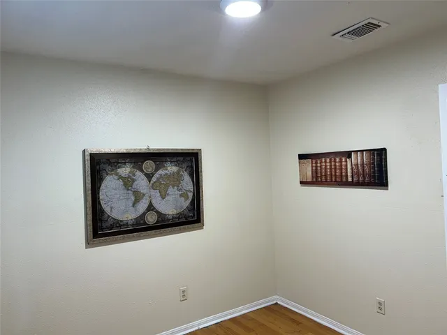 a view of a wall with a painting on the wall