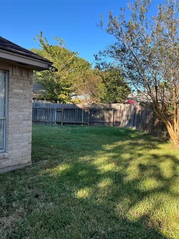 a view of a back yard of the house