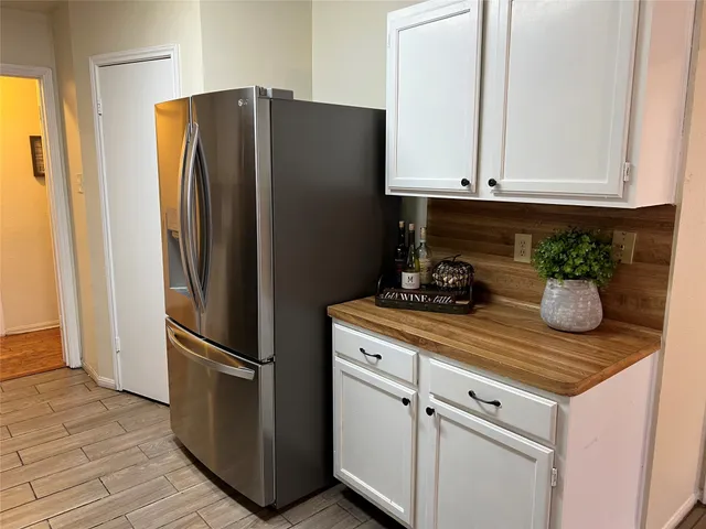a kitchen with appliances and cabinets