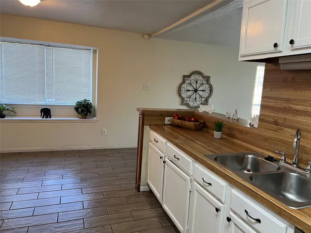 a kitchen with a sink and cabinets