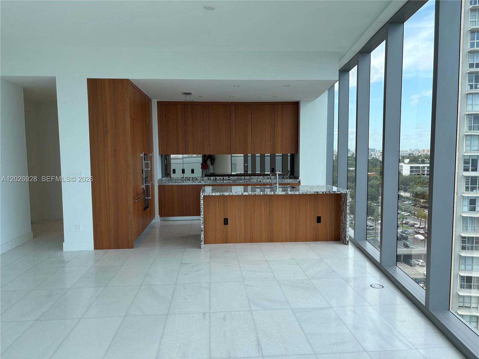 175 Southeast 25th Road, Unit 901 Miami, FL 33129 - Photo 6 of 18 a kitchen with stainless steel appliances a refrigerator and a sink