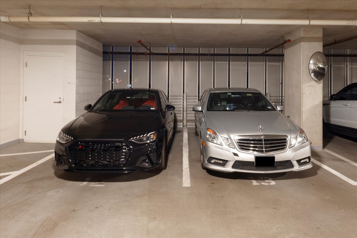 313 West 17th Street, Unit 1104 Austin, TX 78701 - Photo 19 of 40 Two premium Level 2 penthouse parking spaces on :Level 2 (#12 & #13), positioned side-by-side for effortless access within the secure resident garage. Ideal for larger vehicles and daily convenience. Immediately adjacent to both storage untis.