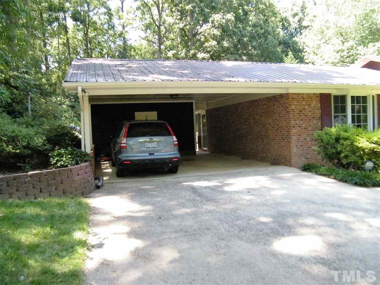 1302 Kingston Ridge Road Cary, NC 27511 - Photo 3 of 25 a view of house and yard with green space
