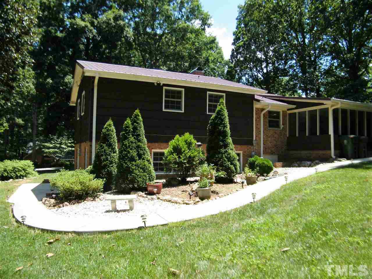 1302 Kingston Ridge Road Cary, NC 27511 - Photo 22 of 25 a view of a house with backyard and garden
