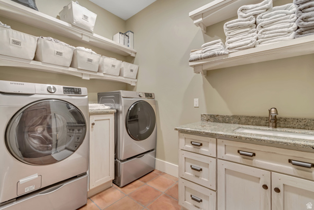 2579 Splendor Valley Road Kamas, UT 84036 - Photo 65 of 87 Laundry area featuring separate washer and dryer, cabinet space, and light tile patterned floors