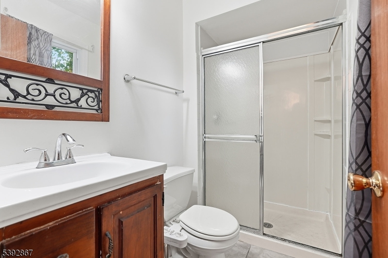 30 Brookside Road Edison, NJ 08817 - Photo 12 of 18 a bathroom with a sink a toilet and shower