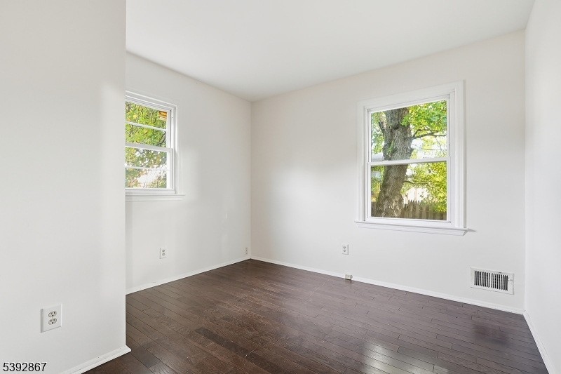 30 Brookside Road Edison, NJ 08817 - Photo 14 of 18 an empty room with wooden floor and windows