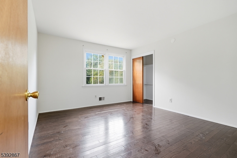 30 Brookside Road Edison, NJ 08817 - Photo 15 of 18 an empty room with wooden floor and windows