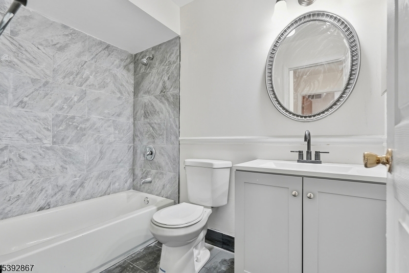 30 Brookside Road Edison, NJ 08817 - Photo 6 of 18 a bathroom with a sink a toilet and a bathtub