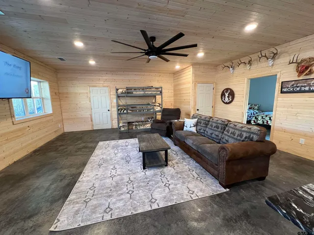 a living room with furniture and a rug