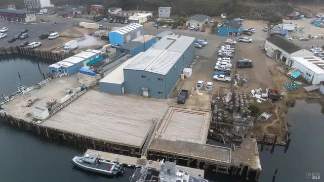 an aerial view of a house with outdoor space