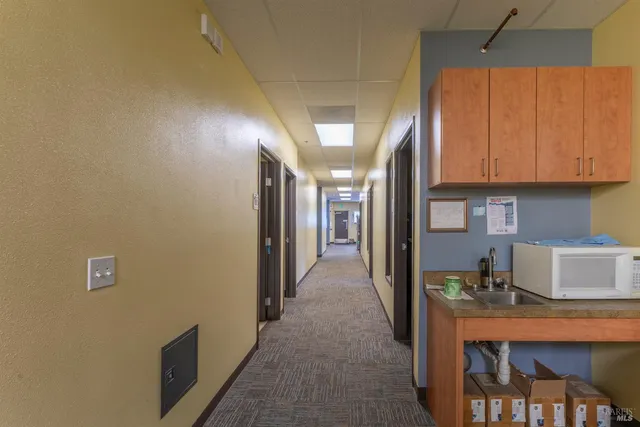 an aerial view of a house with a water view