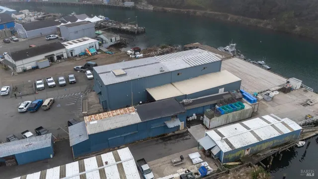 a couple of cars parked in front of a house