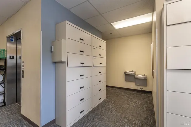 an aerial view of a house with parking space