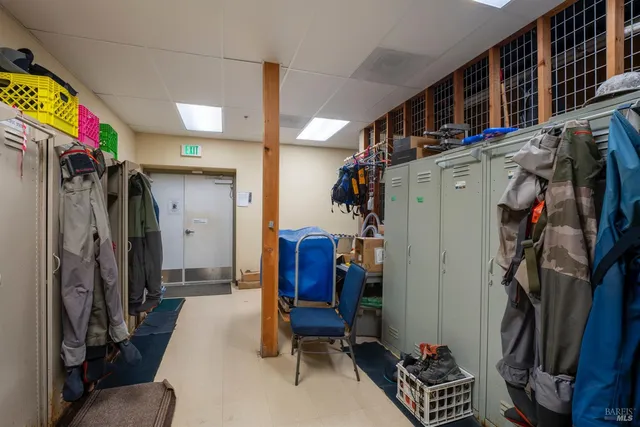 a view of a balcony with chairs and wooden floor