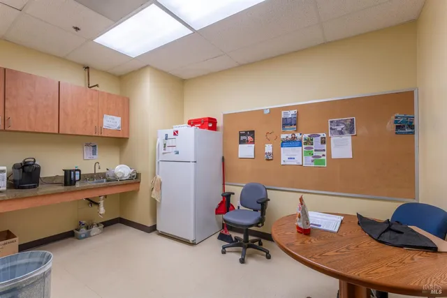 a view of a pool table and chairs in the patio