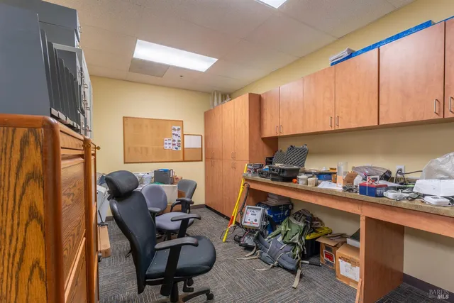 a kitchen with stainless steel appliances kitchen island granite countertop a sink and cabinets