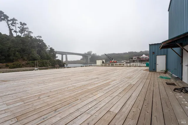 a view of a swimming pool with a lawn chairs