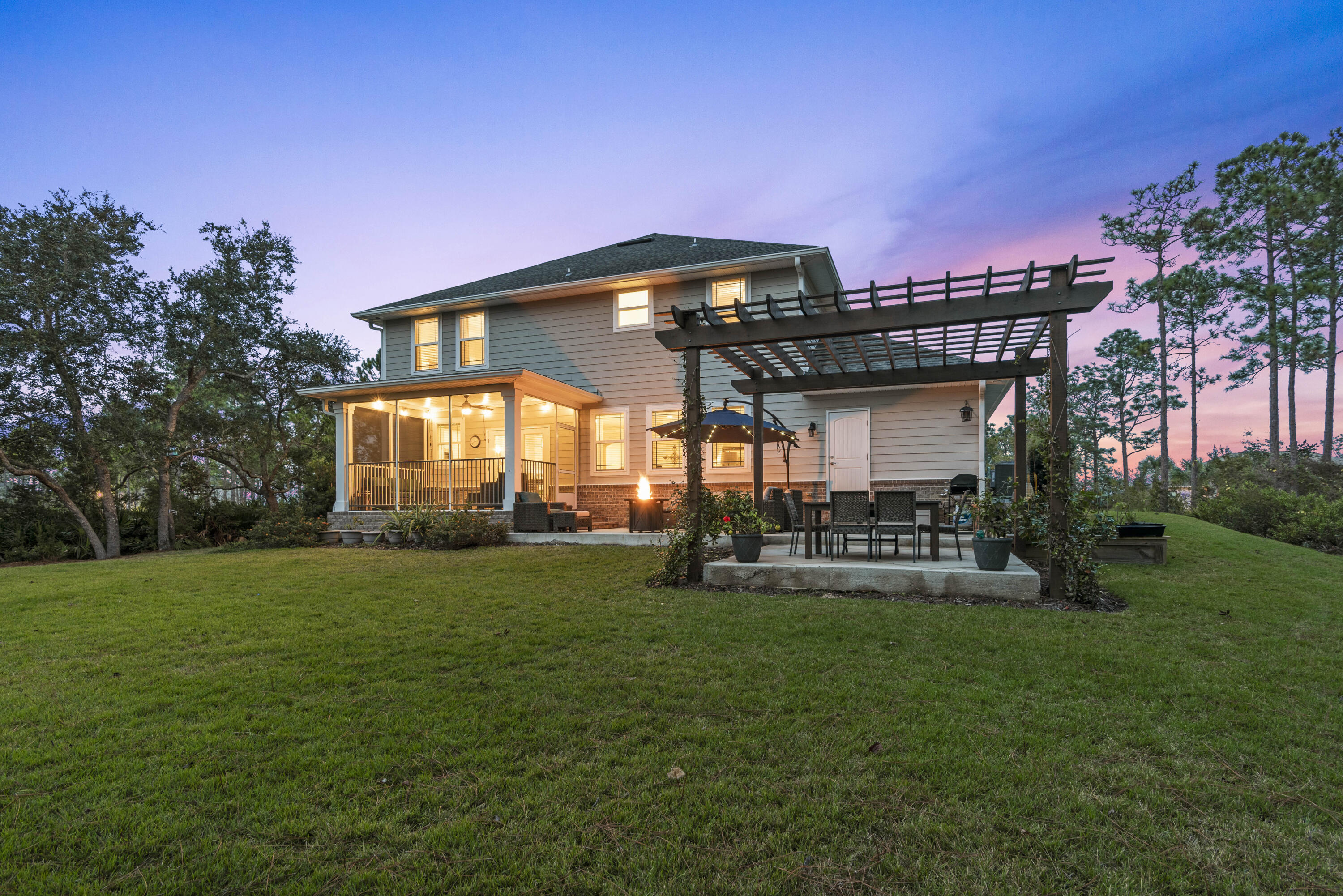 1584 Driftwood Point Road Santa Rosa Beach, FL 32459 - Photo 11 of 50 a front view of a house with swimming pool having outdoor seating