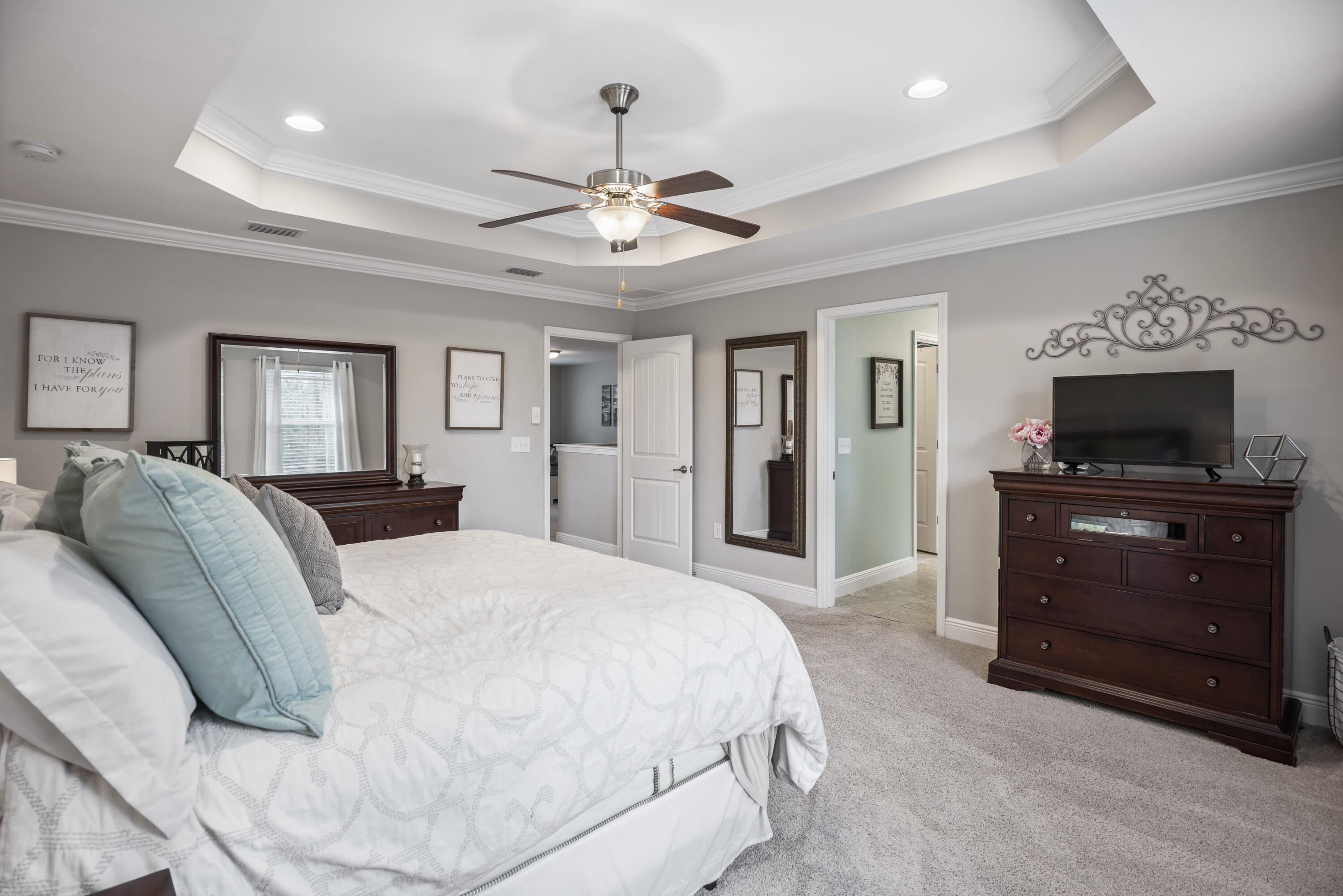 1584 Driftwood Point Road Santa Rosa Beach, FL 32459 - Photo 36 of 50 a spacious bedroom with a bed and a flat screen tv
