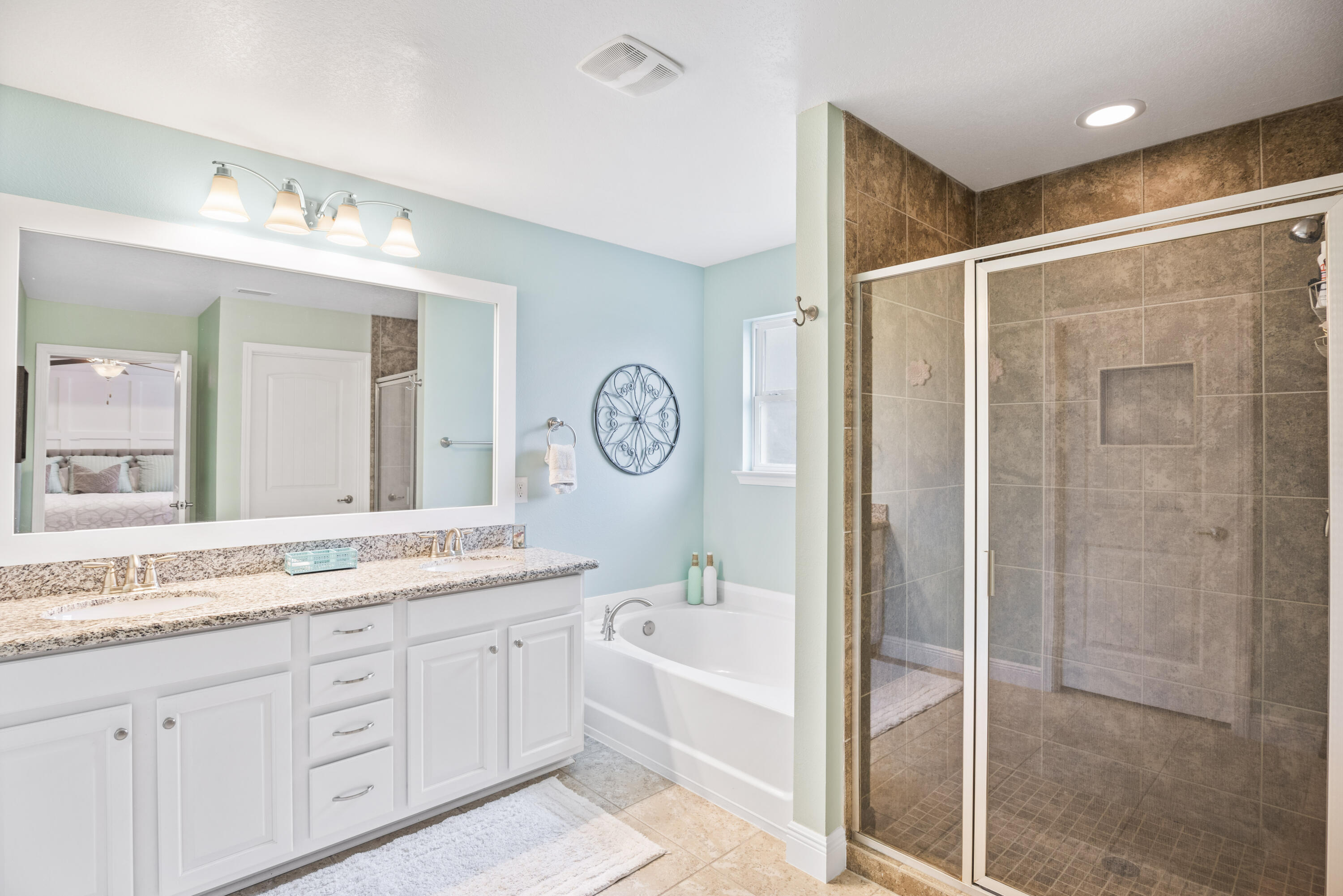 1584 Driftwood Point Road Santa Rosa Beach, FL 32459 - Photo 37 of 50 a bathroom with a granite countertop sink mirror bathtub and shower