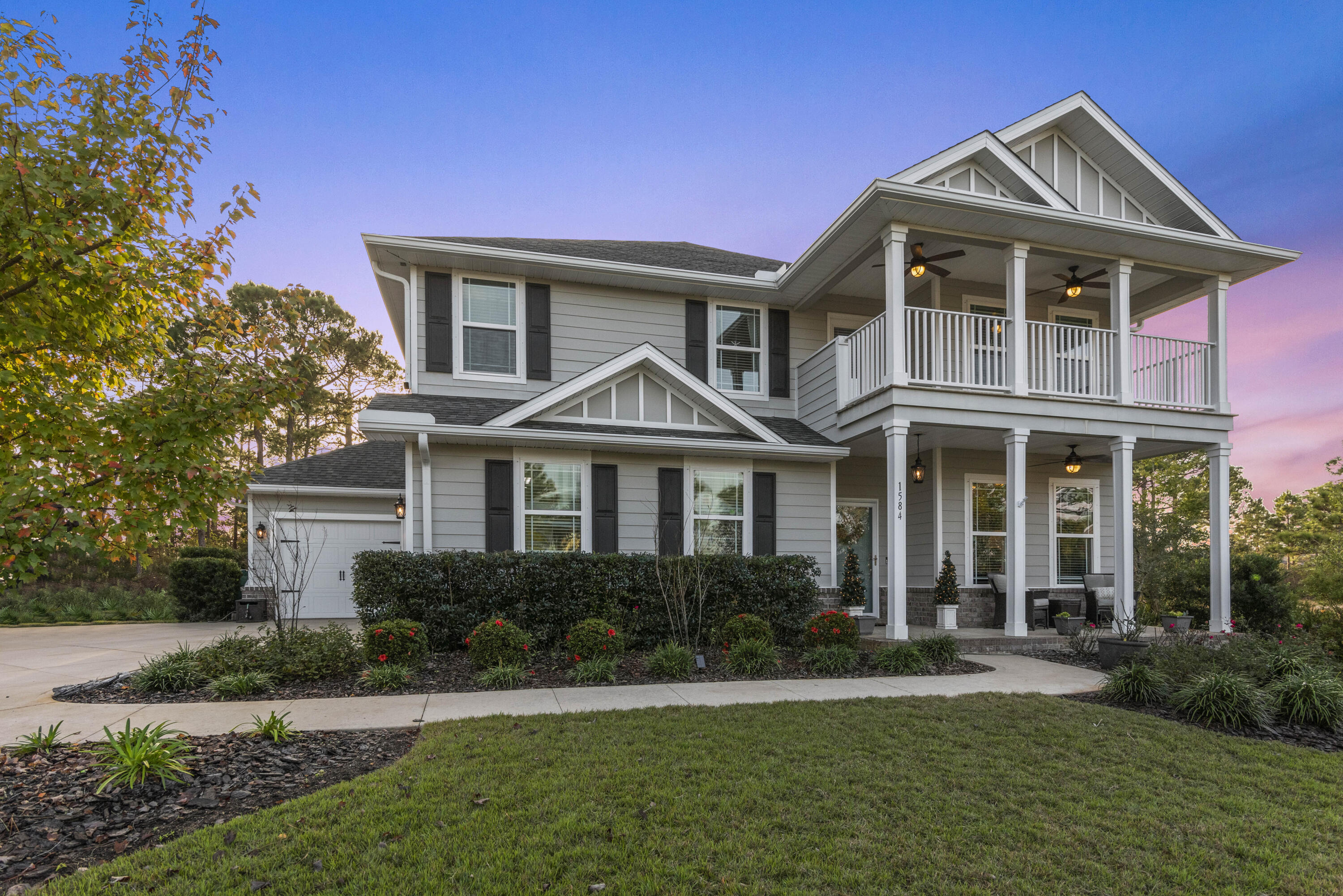 1584 Driftwood Point Road Santa Rosa Beach, FL 32459 - Photo 5 of 50 a front view of a house with a yard