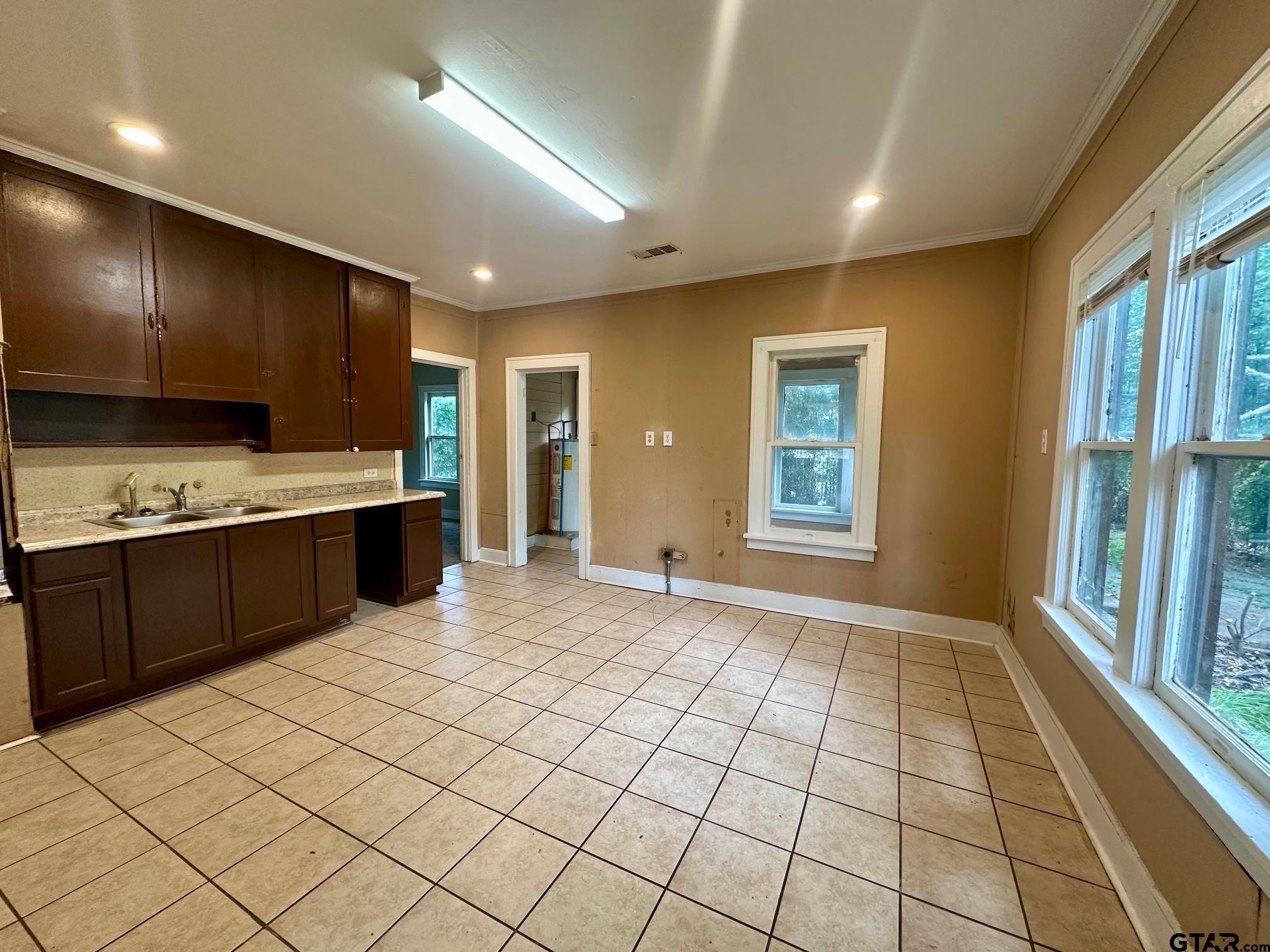 1102 Myrtle Street Kilgore, TX 75662 - Photo 4 of 9 a view of kitchen with windows