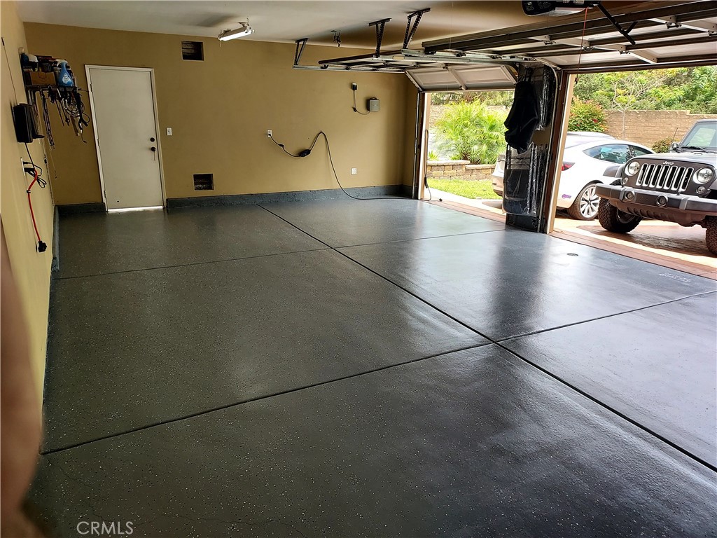 4330 Forest Ranch Way Oceanside, CA 92057 - Photo 37 of 51 The three-car garage offers generous space for parking, storage, and organization, making it as practical as it is polished