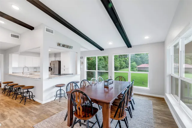 a view of a dining room with furniture window and outside view
