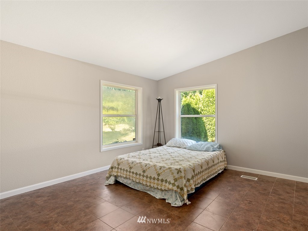 24226 Cromwell Road Monroe, WA 98272 - Photo 23 of 34 a bedroom with a bed and a window