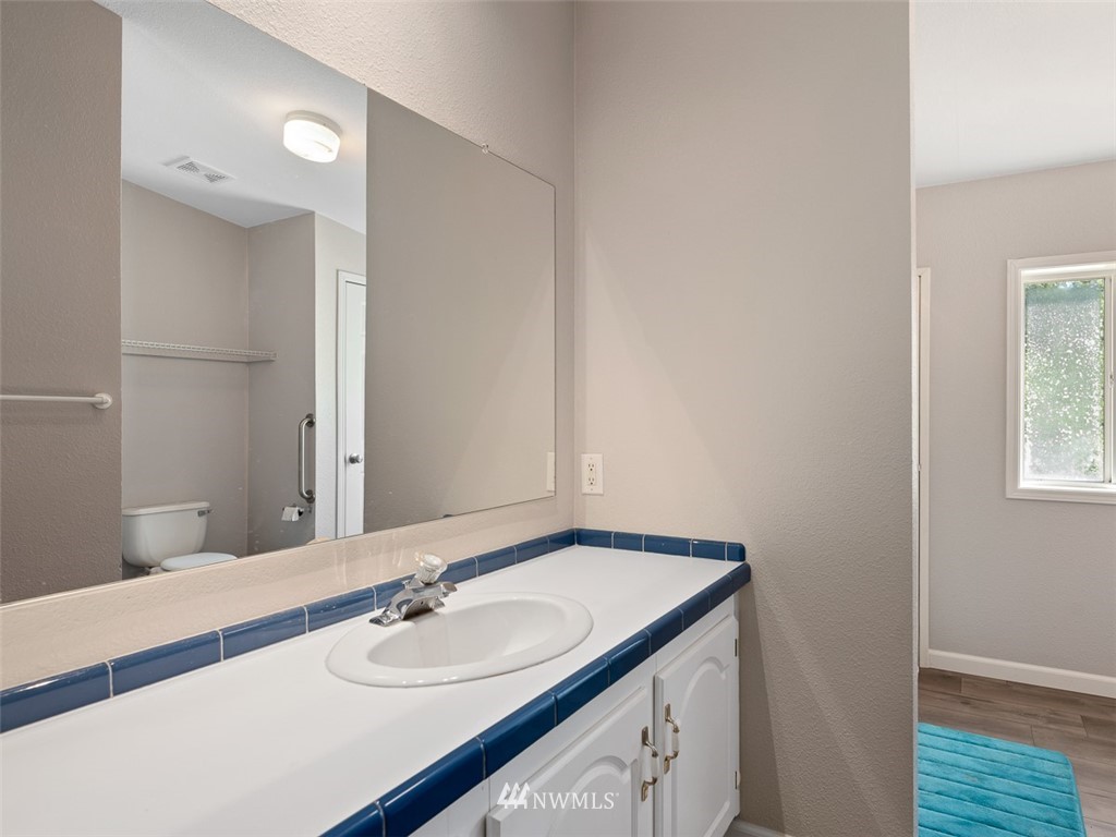 24226 Cromwell Road Monroe, WA 98272 - Photo 24 of 34 a bathroom with a sink and a mirror