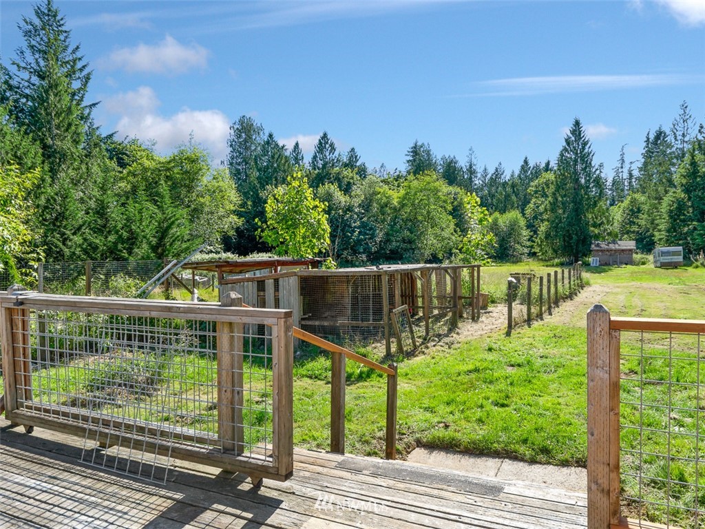 24226 Cromwell Road Monroe, WA 98272 - Photo 29 of 34 a view of a wooden deck with a yard