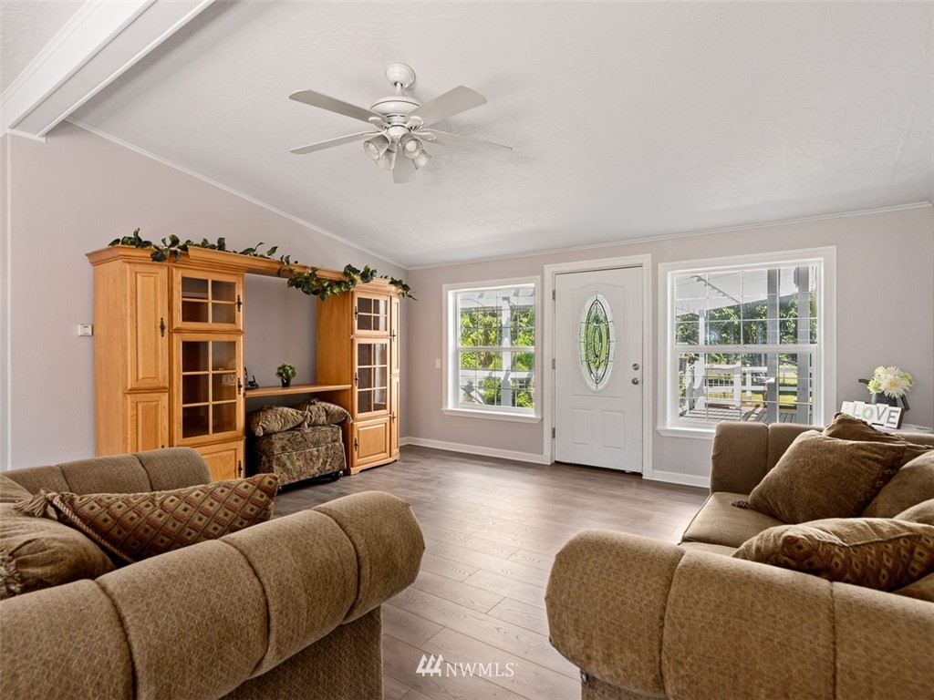 24226 Cromwell Road Monroe, WA 98272 - Photo 5 of 34 a living room with furniture and a flat screen tv