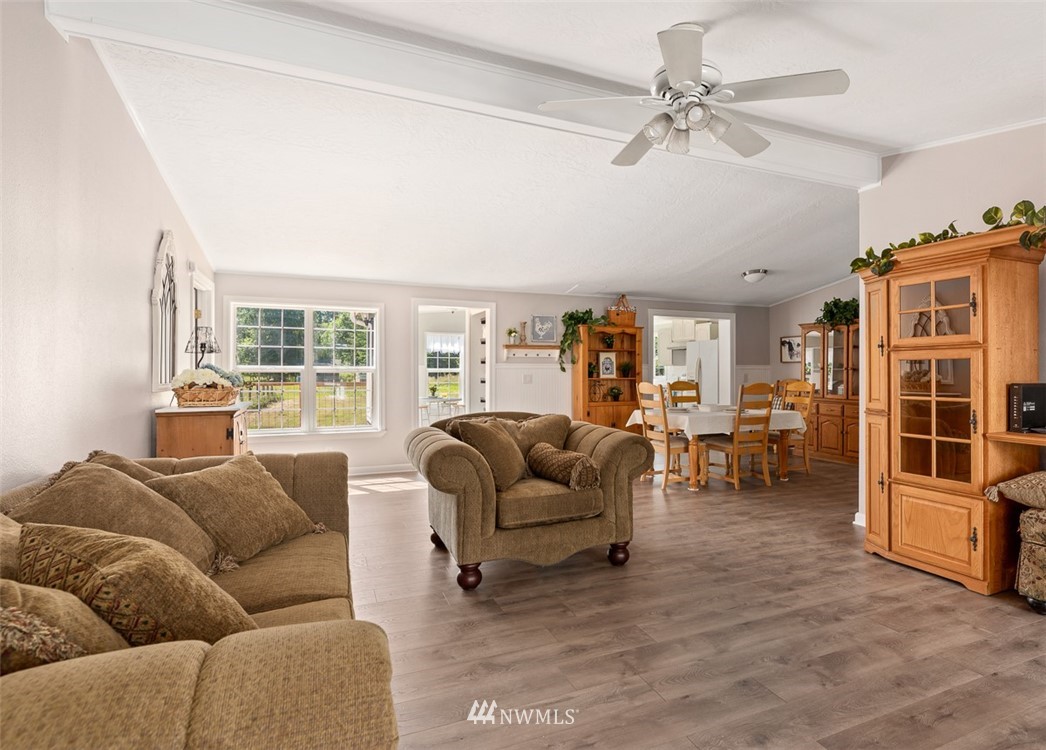 24226 Cromwell Road Monroe, WA 98272 - Photo 6 of 34 a living room with furniture and a flat screen tv