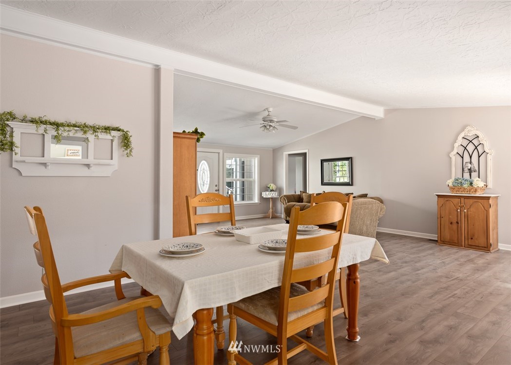 24226 Cromwell Road Monroe, WA 98272 - Photo 8 of 34 a view of a dining room with furniture and wooden floor