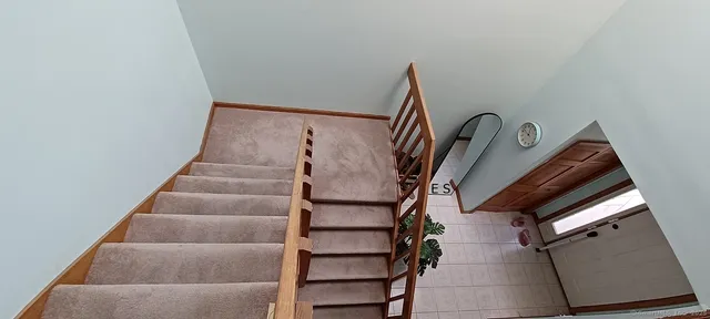 a view of staircase with empty racks