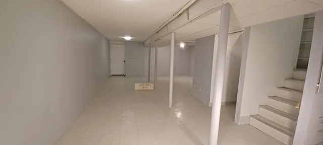 a bathroom with a shower and a glass door