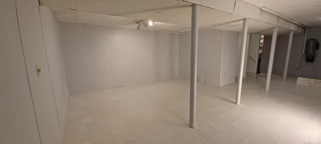 a bathroom with a glass shower door