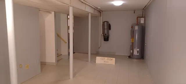 a bathroom with a shower and a sink