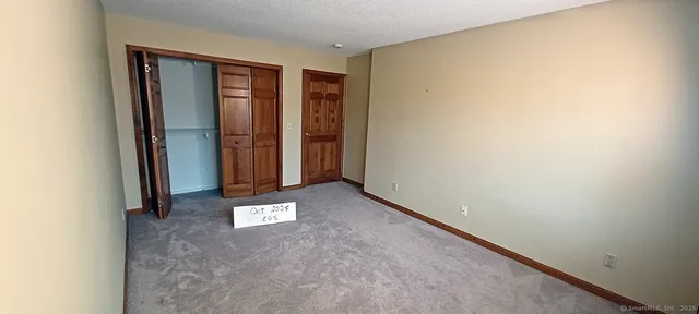 an entryway with ceiling fan