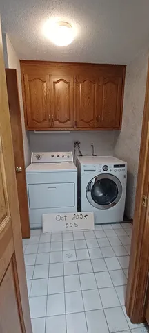 a kitchen with a sink a stove and cabinets
