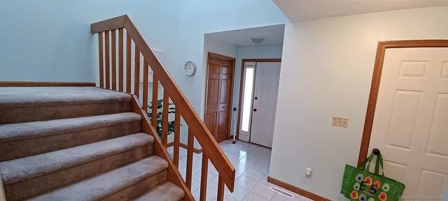 a view of staircase with wooden floor and stairs