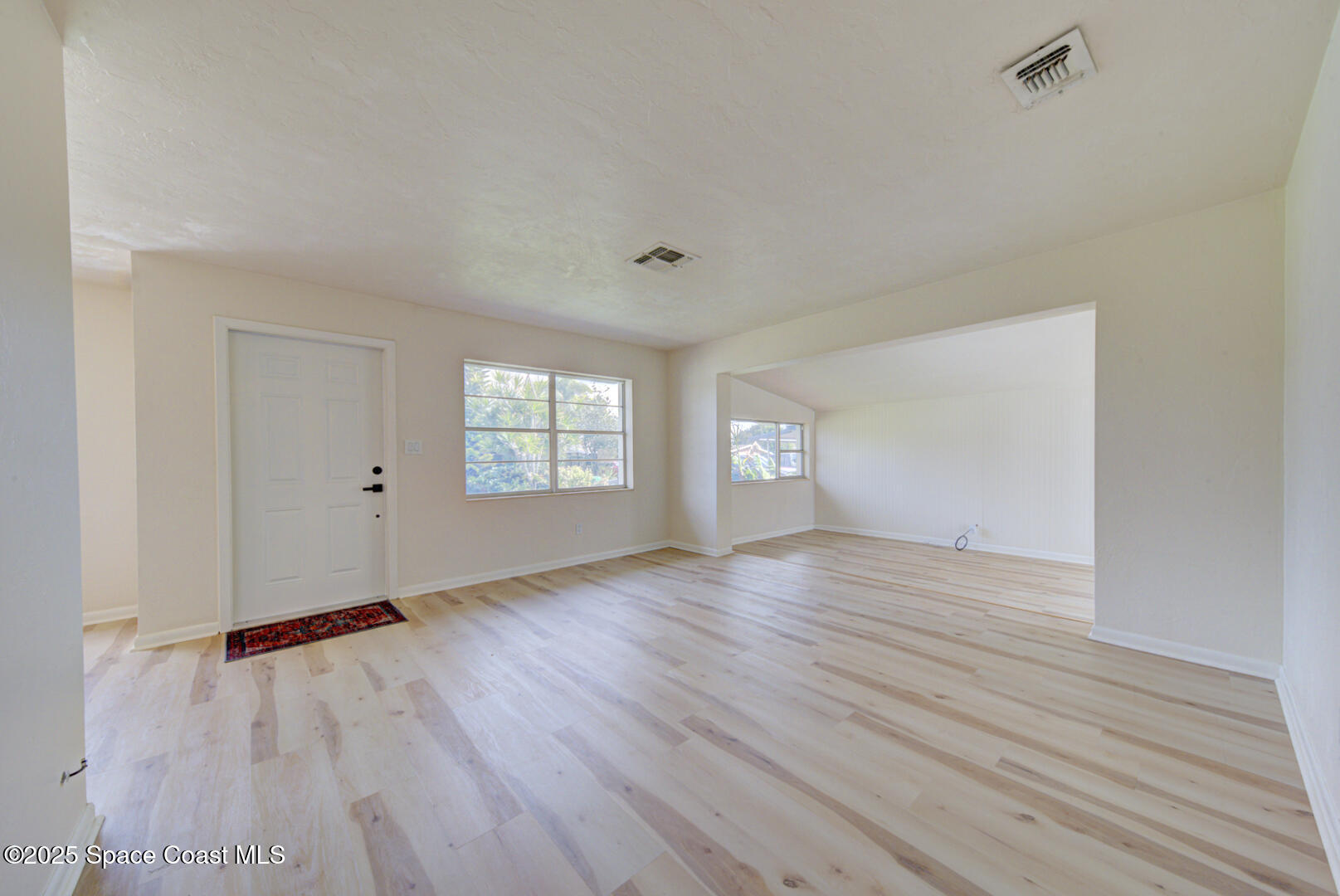 2433 Allan Adale Road Melbourne, FL 32935 - Photo 4 of 29 living room & front door