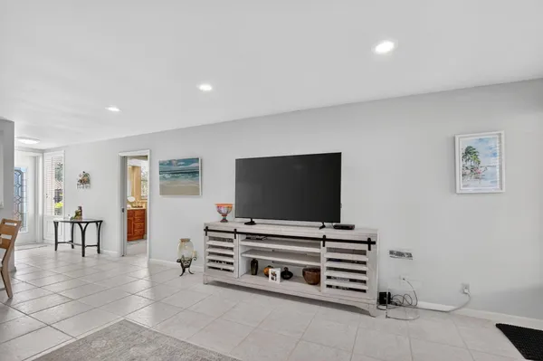 a room with furniture and flat screen tv