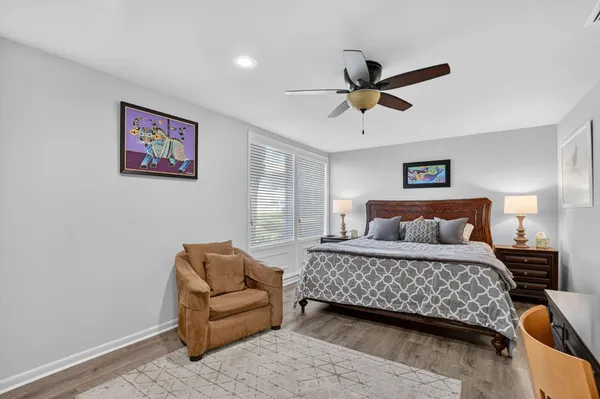 a bedroom with a bed and a couch