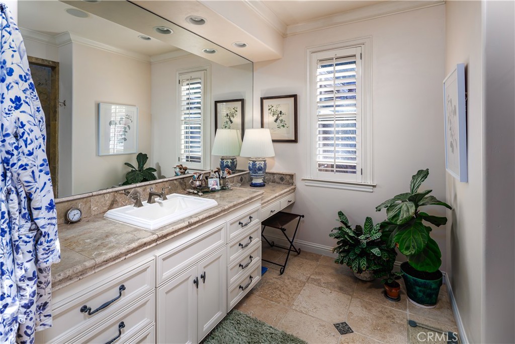 6400 San Gabriel Road Atascadero, CA 93422 - Photo 21 of 50 a bathroom with a granite countertop sink a mirror and a bathtub
