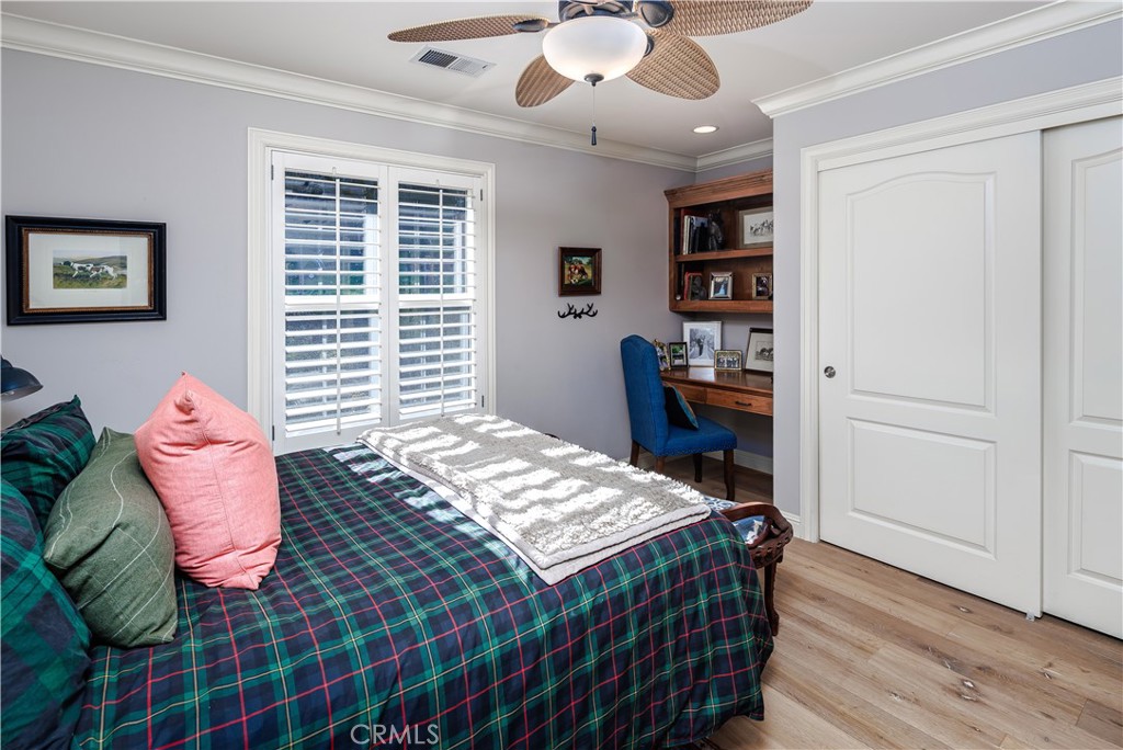 6400 San Gabriel Road Atascadero, CA 93422 - Photo 26 of 50 a bedroom with a bed and wooden floor