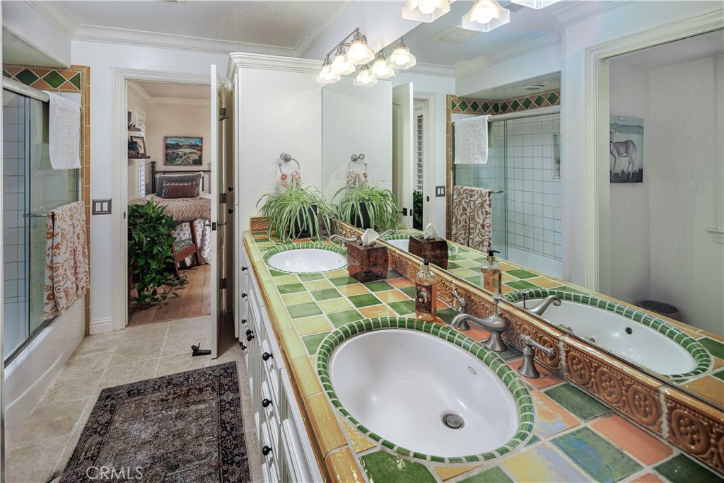 6400 San Gabriel Road Atascadero, CA 93422 - Photo 27 of 50 a bathroom with a double vanity sink mirror and shower